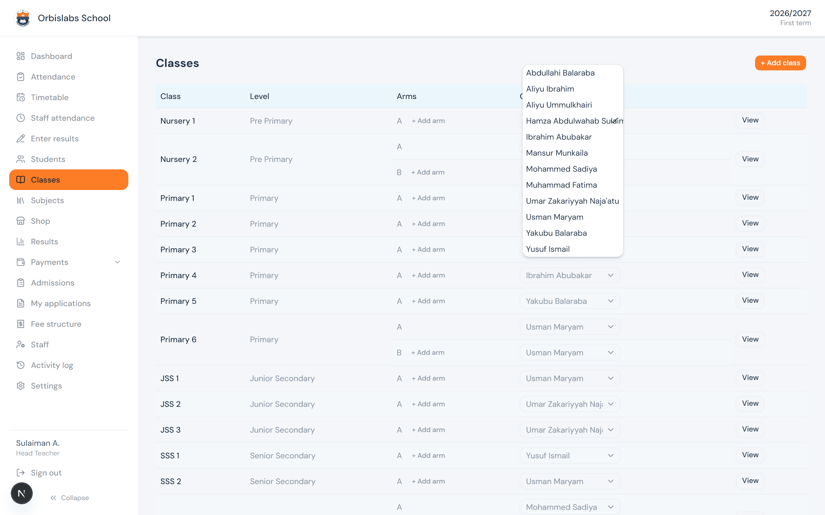 The Classes page with a class-teacher dropdown open on one arm, listing eligible staff